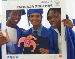 Students from Paterson wearing caps and gowns